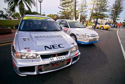 26;27;16-June-2006;ARC;Australia;Australian-Rally-Championship;Elysia-Kruper;Evo-3;Ken-Garrioch;Leigh-Garrioch;Mitsubishi-Lancer;Mitsubishi-Lancer-Evolution-III;Mitsubishi-Mirage;Mooloolaba;QLD;Queensland;Simon-Jansen;Sunshine-Coast;atmosphere;auto;ceremonial-start;motorsport;movement;racing;speed;twilight;wide-angle