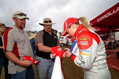 18-June-2006;ARC;Australia;Australian-Rally-Championship;Imbil;QLD;Queensland;Sue-Evans;Sunshine-Coast;atmosphere;auto;autograph;fans;motorsport;portrait;racing;service-park;signature;spectators;wide-angle