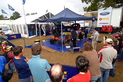 4;18-June-2006;ARC;Australia;Australian-Rally-Championship;Ford-Focus;Imbil;Mark-Stacey;Michael-Guest;Pirtek-Rally-Team-Ford;QLD;Queensland;Sunshine-Coast;auto;motorsport;movement;racing;service-park;speed;wide-angle