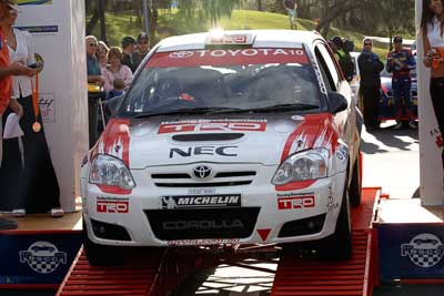 10;18-June-2006;ARC;Australia;Australian-Rally-Championship;Mooloolaba;QLD;Queensland;Simon-Evans;Sue-Evans;Sunshine-Coast;Team-TRD;Toyota-Corolla-Sportivo;auto;ceremonial-finish;motorsport;racing;telephoto