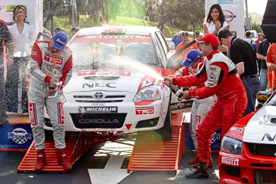 18-June-2006;ARC;Australia;Australian-Rally-Championship;Mooloolaba;QLD;Queensland;Scott-Pedder;Simon-Evans;Sue-Evans;Sunshine-Coast;atmosphere;auto;ceremonial-finish;motorsport;podium;racing;telephoto