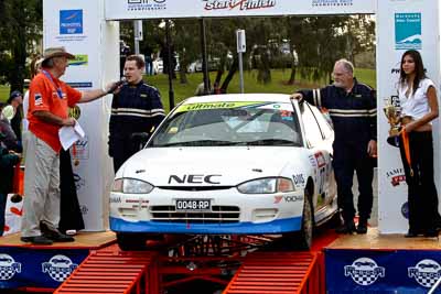 27;18-June-2006;ARC;Australia;Australian-Rally-Championship;Ken-Garrioch;Leigh-Garrioch;Mitsubishi-Mirage;Mooloolaba;QLD;Queensland;Sunshine-Coast;auto;ceremonial-finish;motorsport;racing;telephoto