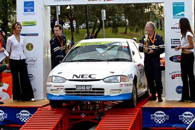27;18-June-2006;ARC;Australia;Australian-Rally-Championship;Ken-Garrioch;Leigh-Garrioch;Mitsubishi-Mirage;Mooloolaba;QLD;Queensland;Sunshine-Coast;auto;ceremonial-finish;motorsport;racing;telephoto