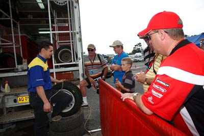 16-November-2008;ARC;Australia;Australian-Rally-Championship;Coffs-Coast;Coffs-Harbour;Michelin;NSW;New-South-Wales;auto;heat-gun;motorsport;racing;service-centre;service-park;spectators;technician;tyres;wide-angle