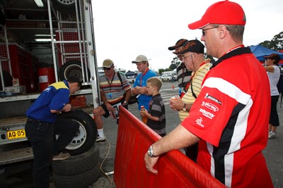 16-November-2008;ARC;Australia;Australian-Rally-Championship;Coffs-Coast;Coffs-Harbour;Michelin;NSW;New-South-Wales;auto;heat-gun;motorsport;racing;service-centre;service-park;spectators;technician;tyres;wide-angle