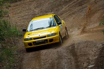 00;16-November-2008;ARC;Australia;Australian-Rally-Championship;Coffs-Coast;Coffs-Harbour;Evo;Mitsubishi-Lancer-Evolution;NSW;New-South-Wales;auto;dirt;motorsport;mud;official;officials;racing;rain;special-stage;splash;super-telephoto;water