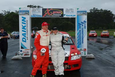 21;16-November-2008;ARC;Australia;Australian-Rally-Championship;Coffs-Coast;Coffs-Harbour;Dennis-Dunlop;Evo-7;Jacqueline-Dunlop;Mitsubishi-Lancer;Mitsubishi-Lancer-Evolution-VII;NSW;New-South-Wales;auto;celebration;motorsport;podium;racing;trophy;wide-angle