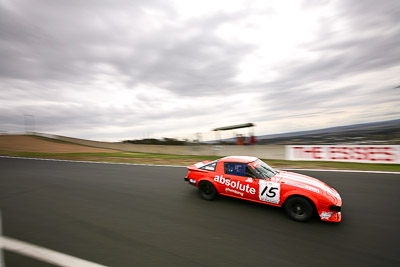 15;10-April-2009;1979-Mazda-RX‒7-Series-1;Australia;Bathurst;FOSC;Festival-of-Sporting-Cars;Graeme-Watts;Improved-Production;Mt-Panorama;NSW;New-South-Wales;auto;clouds;motion-blur;motorsport;racing;sky;wide-angle
