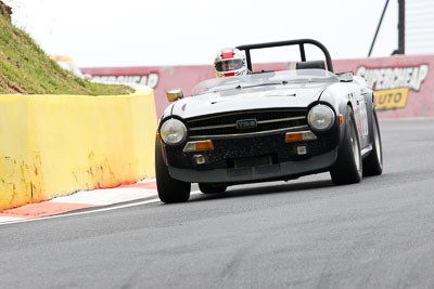 666;11-April-2009;1974-Triumph-TR6;Australia;Bathurst;FOSC;Festival-of-Sporting-Cars;Graeme-Rutledge;Historic-Sports-Cars;Mt-Panorama;NSW;New-South-Wales;auto;classic;motorsport;racing;super-telephoto;vintage