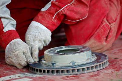 9-May-2009;APRC;Asia-Pacific-Rally-Championship;Australia;IROQ;Imbil;Imbil-Showgrounds;International-Rally-Of-Queensland;QLD;Queensland;Rally-Queensland;Sunshine-Coast;afternoon;auto;brake-disc;dirty;mechanic;motorsport;racing;service;service-centre;service-park;showgrounds;super-telephoto;work