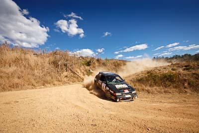 8;19-July-2009;Allan-Clunes;Australia;Gavin-Wieland;Jimna;Mazda-323-GTR;QLD;QRC;Queensland;Queensland-Rally-Championship;Sunshine-Coast;auto;clouds;corner;dirt;dust;gravel;motorsport;racing;scenery;sky;special-stage;wide-angle