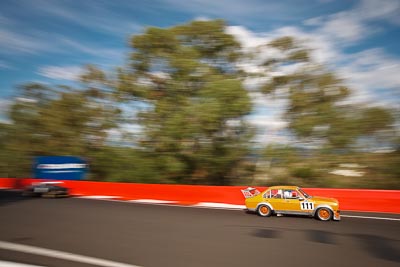111;1977-Ford-Escort;3-April-2010;Australia;Bathurst;FOSC;Festival-of-Sporting-Cars;Lawrie-Watson;Mt-Panorama;NSW;New-South-Wales;Regularity;auto;motion-blur;motorsport;racing;trees;wide-angle