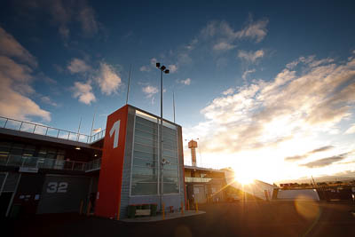 4-April-2010;Australia;Bathurst;FOSC;Festival-of-Sporting-Cars;Mt-Panorama;NSW;New-South-Wales;atmosphere;auto;building;clouds;morning;motorsport;paddock;racing;sky;sun;wide-angle