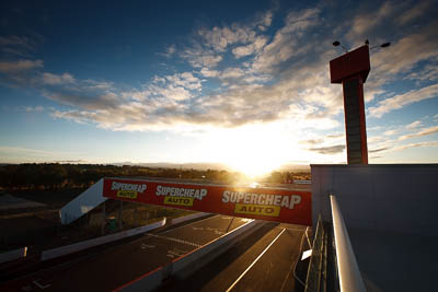 4-April-2010;Australia;Bathurst;FOSC;Festival-of-Sporting-Cars;Mt-Panorama;NSW;New-South-Wales;atmosphere;auto;building;clouds;morning;motorsport;paddock;pit-lane;racing;sky;sun;wide-angle