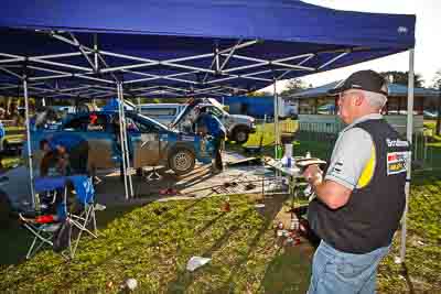 31-July-2010;APRC;Asia-Pacific-Rally-Championship;Australia;Imbil;QLD;Queensland;Sunshine-Coast;auto;motorsport;portrait;racing;scrutineer;service-centre;service-park;wide-angle