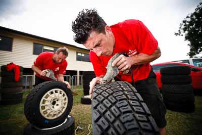 1-August-2010;APRC;Asia-Pacific-Rally-Championship;Australia;Imbil;QLD;Queensland;Sunshine-Coast;Team-MRF;Topshot;Wayne-Moore;auto;mechanic;motorsport;portrait;racing;service-centre;service-park;tyres;wide-angle