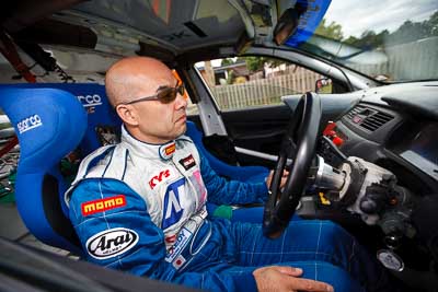 1-August-2010;APRC;Asia-Pacific-Rally-Championship;Atsushi-Masumura;Australia;Imbil;QLD;Queensland;Sunshine-Coast;auto;motorsport;portrait;racing;service-centre;service-park;wide-angle