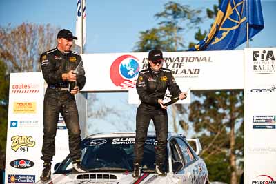 1-August-2010;ARC;Australia;Australian-Rally-Championship;Imbil;QLD;Queensland;Simon-Evans;Sue-Evans;Sunshine-Coast;auto;celebration;motorsport;official-finish;podium;portrait;racing;telephoto