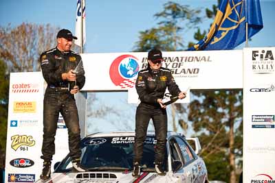 1-August-2010;ARC;Australia;Australian-Rally-Championship;Imbil;QLD;Queensland;Simon-Evans;Sue-Evans;Sunshine-Coast;auto;celebration;motorsport;official-finish;podium;portrait;racing;telephoto