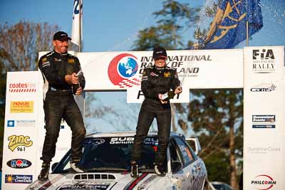 1-August-2010;ARC;Australia;Australian-Rally-Championship;Imbil;QLD;Queensland;Simon-Evans;Sue-Evans;Sunshine-Coast;auto;celebration;motorsport;official-finish;podium;portrait;racing;telephoto