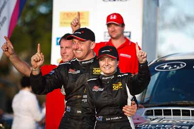 1-August-2010;ARC;Australia;Australian-Rally-Championship;Imbil;QLD;Queensland;Simon-Evans;Sue-Evans;Sunshine-Coast;auto;celebration;motorsport;official-finish;podium;portrait;racing;telephoto