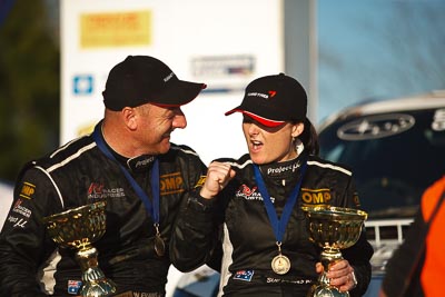 1-August-2010;ARC;Australia;Australian-Rally-Championship;Imbil;QLD;Queensland;Simon-Evans;Sue-Evans;Sunshine-Coast;auto;celebration;motorsport;official-finish;podium;portrait;racing;telephoto