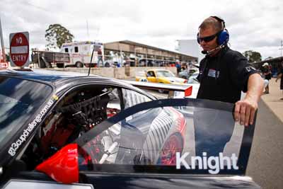 22;12-March-2011;22;28mm;Australia;CAMS-State-Championships;Morgan-Park-Raceway;Porsche-996-GT3-Cup;Production-Sports-Cars;QLD;Queensland;Terry-Knight;Warwick;atmosphere;auto;mechanic;motorsport;paddock;portrait;racing;wide-angle