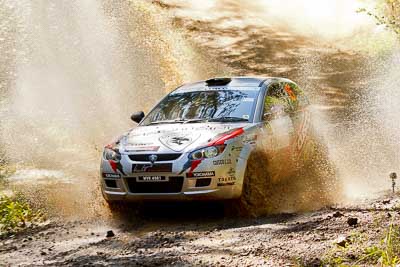 15;14-May-2011;APRC;Asia-Pacific-Rally-Championship;Australia;IROQ;Imbil;International-Rally-Of-Queensland;Karamjit-Singh;Proton-Cusco-Rally-Team;Proton-Satria-Neo;QLD;Queensland;Sunshine-Coast;Vivek-Ponnusamy;auto;motorsport;racing;telephoto;water-splash