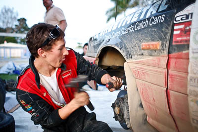 14-May-2011;28mm;Australia;Australian-Junior-Challenge;Cameron-Sluce;IROQ;Imbil;International-Rally-Of-Queensland;QLD;Queensland;Sunshine-Coast;Topshot;action;auto;hammer;mechanic;motorsport;portrait;racing;repair;service-park;twilight;wide-angle;working