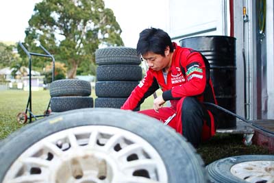 15-May-2011;28mm;APRC;Asia-Pacific-Rally-Championship;Australia;IROQ;Imbil;International-Rally-Of-Queensland;QLD;Queensland;Soueast-Motor-Kumho-Team;Sunshine-Coast;auto;detail;mechanic;motorsport;portrait;racing;service-park;tyres;wheel;wide-angle