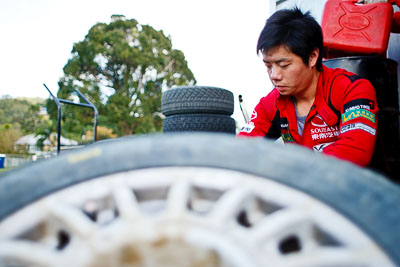 15-May-2011;28mm;APRC;Asia-Pacific-Rally-Championship;Australia;IROQ;Imbil;International-Rally-Of-Queensland;QLD;Queensland;Soueast-Motor-Kumho-Team;Sunshine-Coast;auto;detail;mechanic;motorsport;portrait;racing;service-park;tyres;wheel;wide-angle