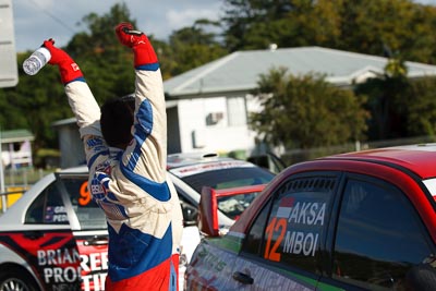 12;12;15-May-2011;APRC;Asia-Pacific-Rally-Championship;Australia;Bosowa-Rally-Team;Hade-Mboi;IROQ;Imbil;International-Rally-Of-Queensland;Mitsubishi-Lancer-Evolution-IX;QLD;Queensland;Subhan-Aksa;Sunshine-Coast;Topshot;auto;motorsport;portrait;racing;regroup;service-park;stretching;telephoto