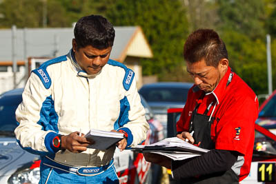 15-May-2011;APRC;Asia-Pacific-Rally-Championship;Australia;Cusco;IROQ;Imbil;International-Rally-Of-Queensland;QLD;Queensland;Sunshine-Coast;Vivek-Ponnusamy;auto;mechanic;motorsport;portrait;racing;service-park;telephoto