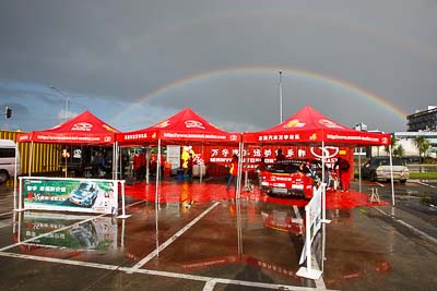 15-July-2011;APRC;Asia-Pacific-Rally-Championship;International-Rally-Of-Whangarei;NZ;New-Zealand;Northland;Rally;Soueast-Motor-Kumho-Team;Whangarei;auto;clouds;garage;motorsport;pre‒event;racing;rainbow;service-park;sky;tent;wide-angle
