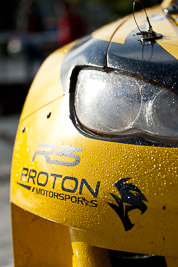 15-July-2011;APRC;Asia-Pacific-Rally-Championship;International-Rally-Of-Whangarei;NZ;New-Zealand;Northland;Proton-Motorsports;Proton-Satria-Neo-S2000;Rally;Topshot;Whangarei;auto;brand;detail;garage;headlights;logo;motorsport;pre‒event;racing;service-park;telephoto