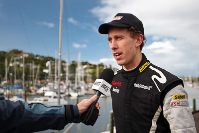 15-July-2011;APRC;Asia-Pacific-Rally-Championship;Brendan-Reeves;International-Rally-Of-Whangarei;NZ;New-Zealand;Northland;Rally;Whangarei;auto;garage;interview;media;motorsport;portrait;pre‒event;racing;service-park;wide-angle