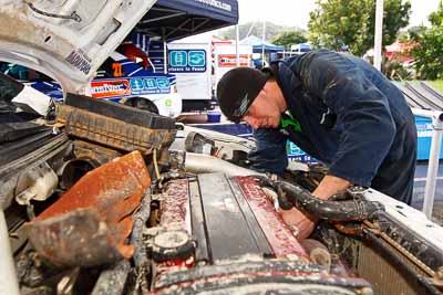 8;15-July-2011;8;APRC;Asia-Pacific-Rally-Championship;International-Rally-Of-Whangarei;Mitsubishi-Lancer-Evolution-IX;NZ;New-Zealand;Northland;Rally;Whangarei;auto;engine-bay;garage;mechanics;motorsport;portrait;pre‒event;racing;service-park;wide-angle