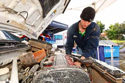 8;15-July-2011;8;APRC;Asia-Pacific-Rally-Championship;International-Rally-Of-Whangarei;Mitsubishi-Lancer-Evolution-IX;NZ;New-Zealand;Northland;Rally;Whangarei;auto;engine-bay;garage;mechanics;motorsport;portrait;pre‒event;racing;service-park;wide-angle