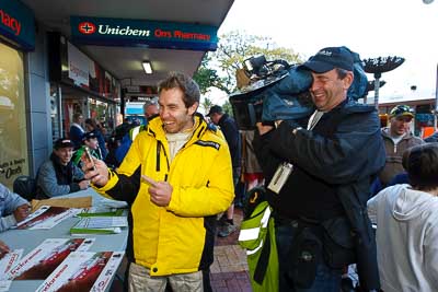 15-July-2011;APRC;Asia-Pacific-Rally-Championship;Chris-Atkinson;International-Rally-Of-Whangarei;NZ;New-Zealand;Northland;Rally;Tony;Whangarei;auto;autograph;cameraman;fans;garage;motorsport;portrait;pre‒event;racing;spectators;start;wide-angle