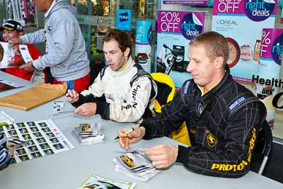 15-July-2011;APRC;Alister-McRae;Asia-Pacific-Rally-Championship;Chris-Atkinson;International-Rally-Of-Whangarei;NZ;New-Zealand;Northland;Rally;Whangarei;auto;autograph;fans;garage;motorsport;portrait;pre‒event;racing;spectators;start;wide-angle