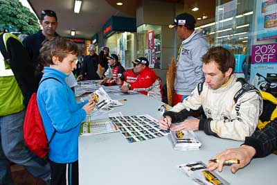 15-July-2011;APRC;Asia-Pacific-Rally-Championship;Chris-Atkinson;International-Rally-Of-Whangarei;NZ;New-Zealand;Northland;Rally;Whangarei;auto;autograph;fans;garage;motorsport;portrait;pre‒event;racing;spectators;start;wide-angle