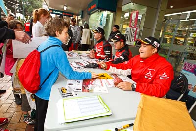 15-July-2011;APRC;Asia-Pacific-Rally-Championship;International-Rally-Of-Whangarei;NZ;New-Zealand;Northland;Rally;Subhan-Aksa;Whangarei;auto;autograph;fans;garage;motorsport;portrait;pre‒event;racing;spectators;start;wide-angle