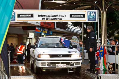 72;15-July-2011;APRC;Asia-Pacific-Rally-Championship;Ben-Huband;Candice-Cunningham;International-Rally-Of-Whangarei;NZ;New-Zealand;Northland;Rally;Subaru-Legacy;Whangarei;auto;ceremonial-start;ceremony;garage;motorsport;pre‒event;racing;start;telephoto