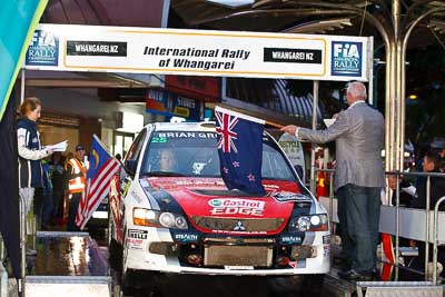 25;15-July-2011;25;APRC;Asia-Pacific-Rally-Championship;Chris-West;Erin-Kyle;International-Rally-Of-Whangarei;Mitsubishi-Lancer-Evolution-IX;NZ;New-Zealand;Northland;Rally;Whangarei;auto;ceremonial-start;ceremony;garage;motorsport;pre‒event;racing;start;telephoto