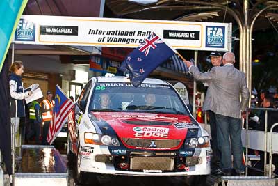 25;15-July-2011;25;APRC;Asia-Pacific-Rally-Championship;Chris-West;Erin-Kyle;International-Rally-Of-Whangarei;Mitsubishi-Lancer-Evolution-IX;NZ;New-Zealand;Northland;Rally;Whangarei;auto;ceremonial-start;ceremony;garage;motorsport;pre‒event;racing;start;telephoto