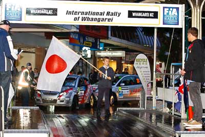 15-July-2011;APRC;Asia-Pacific-Rally-Championship;International-Rally-Of-Whangarei;NZ;New-Zealand;Northland;Rally;Whangarei;auto;ceremonial-start;ceremony;child;flag;garage;kid;motorsport;night;pre‒event;racing;start;telephoto