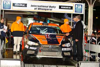 10;10;15-July-2011;APRC;Asia-Pacific-Rally-Championship;International-Rally-Of-Whangarei;Mitsubishi-Lancer-Evolution-X;NZ;New-Zealand;Northland;Rally;Sloan-Cox;Tarryn-Cox;Whangarei;auto;ceremonial-start;ceremony;garage;motorsport;pre‒event;racing;start;telephoto