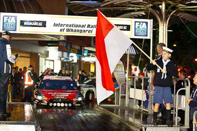 15-July-2011;APRC;Asia-Pacific-Rally-Championship;International-Rally-Of-Whangarei;NZ;New-Zealand;Northland;Rally;Whangarei;auto;ceremonial-start;ceremony;child;flag;garage;kid;motorsport;night;pre‒event;racing;start;telephoto