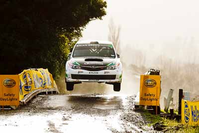 24;16-July-2011;2011-International-Rally-Of-Whangarei;24;APRC;Asia-Pacific-Rally-Championship;Hayden-Paddon;International-Rally-Of-Whangarei;John-Kennard;NZ;New-Zealand;Northland;Subaru-Impreza-WRX-STI;Topshot;Whangarei;auto;bridge;garage;jump;motorsport;mud;racing;rain;special-stage;stage;super-telephoto;wet