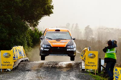 10;10;16-July-2011;APRC;Asia-Pacific-Rally-Championship;International-Rally-Of-Whangarei;Mitsubishi-Lancer-Evolution-X;NZ;New-Zealand;Northland;Rally;Sloan-Cox;Tarryn-Cox;Whangarei;auto;garage;motorsport;racing;special-stage;super-telephoto